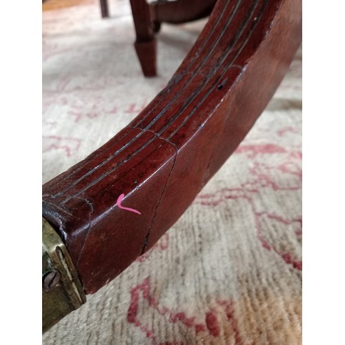 975 - A mahogany breakfast table, 19th century, the rectangular top with rounded corners upon four channel... 