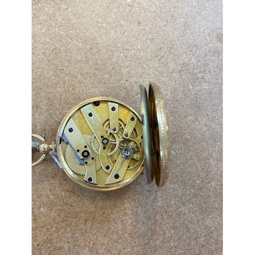 117 - A late 19th century yellow metal ladies fob watch, the gold coloured dial with central engraved flor... 