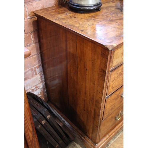 907 - A burr elm chest of drawers, early 18th century, the quarter veneered and cross banded top over an a... 