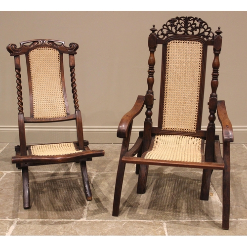 1003 - A 19th century walnut and cane work folding campaign chair, with a carved scrolling openwork foliate... 