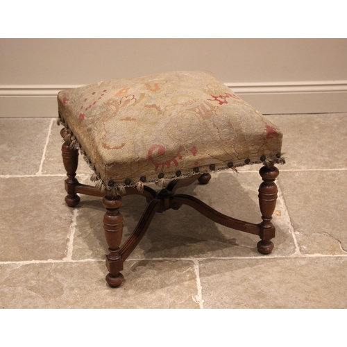 1006 - A 17th century style walnut and upholstered dressing stool, 19th century, the square Aubusson type s... 