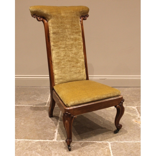 1019 - A Victorian rosewood framed prie-dieu chair, upholstered in golden velour, the high back with carved... 