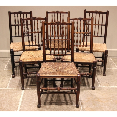 1025 - A matched set of six Lancashire spindle back chairs, mid 19th century, each chair with two rows of t... 