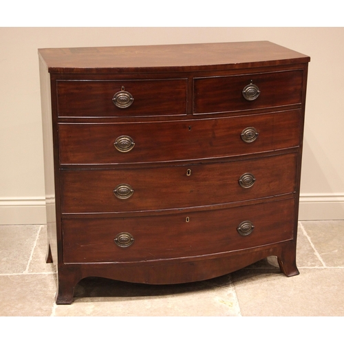 1027 - An early 19th century mahogany bowfront chest of drawers, the figured top above an arrangement of tw... 