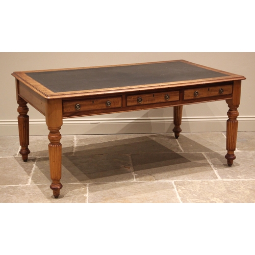 1030 - A large Victorian mahogany writing desk, the rectangular moulded top with inset leather skiver above... 