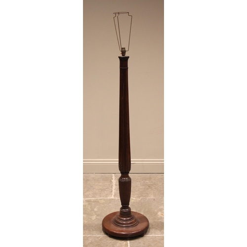 1042 - A Regency style mahogany standard lamp, early 20th century, the tapering acanthus moulded column ext... 