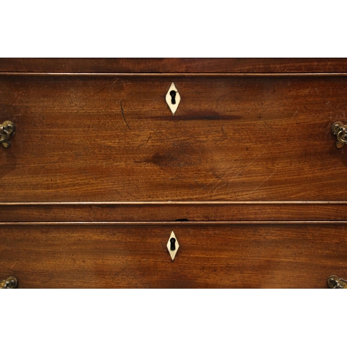 1046 - A George IV mahogany straight front chest of drawers, formed with a cross banded frieze over an arra... 