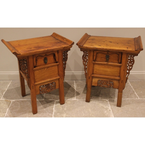 1048 - A near pair of Chinese influence elm bedside/lamp tables, early 20th century, each with an oversaili... 