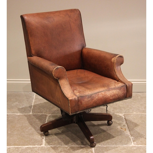 1053 - A revolving leather office chair, by Hillcrest, mid 20th century, the upholstered leather seat with ... 