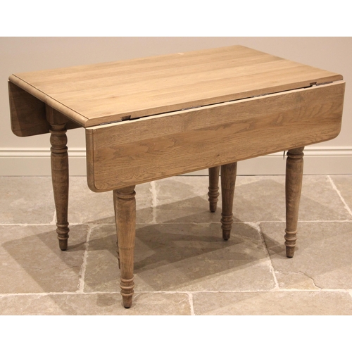 1073 - An Oka 'Charlotte' extending dining table, constructed from alder wood with a weathered oak finish, ... 