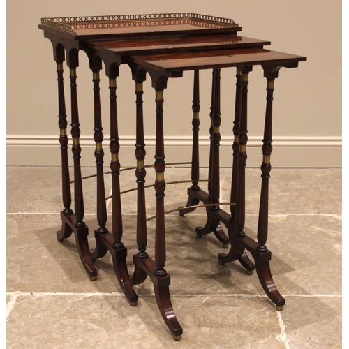 1077 - A nest of three rosewood and mahogany occasional tables, by Theodore Alexander, the largest table wi... 