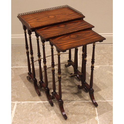 1077 - A nest of three rosewood and mahogany occasional tables, by Theodore Alexander, the largest table wi... 