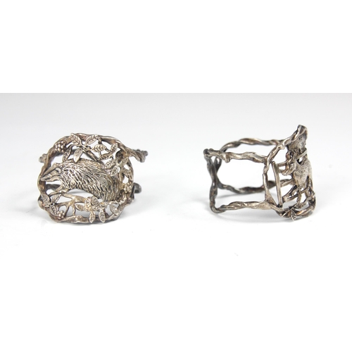 111 - A set of two silver coloured napkin rings, possibly Dutch, the openwork circular rings with stylised... 