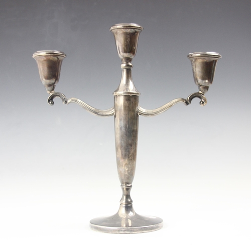 117 - A silver candelabra, Henry Clifford Davis, Birmingham 1960, the central urn shaped sconce flanked by... 