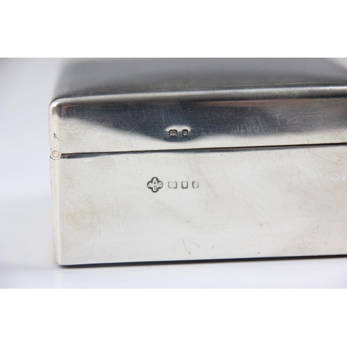 126 - A silver mounted cigarette box, Asprey & Co Ltd, London 1959, the engine turned hinged cover opening... 