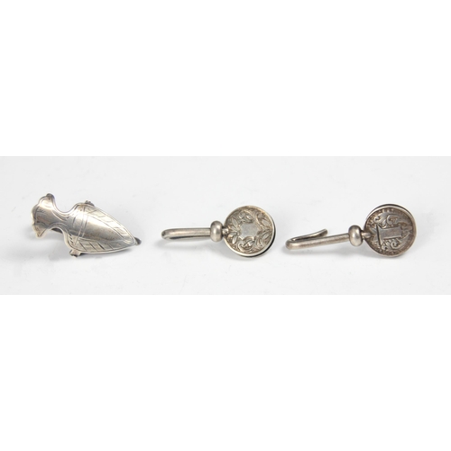 127 - A group of three silver napkin clips, including an Edwardian example, C E Williams, Birmingham 1902,... 