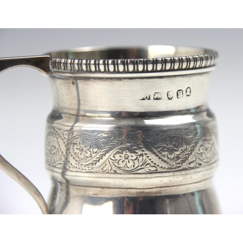 128 - A George III silver mug, indistinct makers mark, London 1812, the gadroon rim above waisted and flar... 