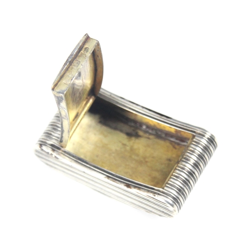 130 - A George III silver snuff box, John Shaw, Birmingham 1806, the boat shaped grooved box with hinged c... 