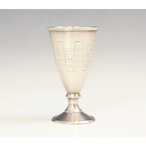 142 - A continental silver goblet, Tallin, c1960, the elongated tapering goblet with engraved detail and g... 