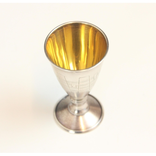 142 - A continental silver goblet, Tallin, c1960, the elongated tapering goblet with engraved detail and g... 