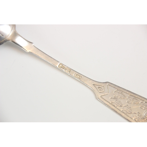 143 - A Russian silver Imperial fiddle pattern dessert spoon, Ivan Khlebnikov, c1880, the engraved termina... 