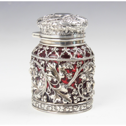 150 - A Victorian silver mounted dressing table jar, Sampson Mordan and Co, London 1892, the cranberry gla... 