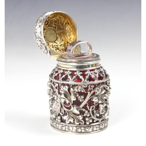 150 - A Victorian silver mounted dressing table jar, Sampson Mordan and Co, London 1892, the cranberry gla... 