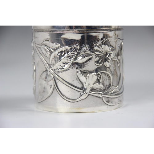 152 - An Edwardian silver jar and cover, William Comyns, London 1901, the circular jar embossed with scrol... 