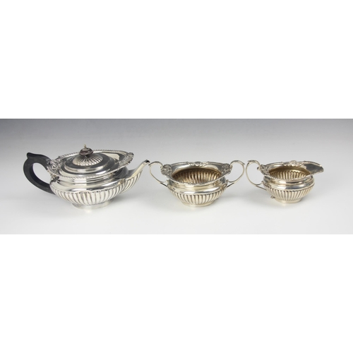 157 - A Victorian silver three piece tea service, Walter and John Barnard, London 1893, comprising a teapo... 