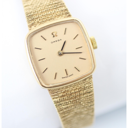 193 - A yellow gold Omega ladies wrist watch, the square shaped gold coloured dial with baton markers, set... 