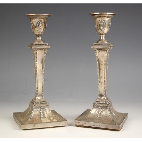 2 - A pair of Edwardian silver candlesticks, Hawksworth, Eyre and Co Ltd, Sheffield 1900, the urn shaped... 