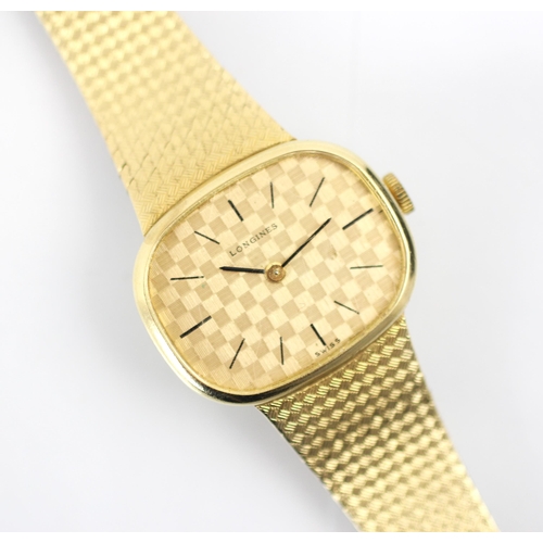 202 - A Longines 9ct yellow gold watch, the round rectangular dial with 'chess board' style design, set to... 