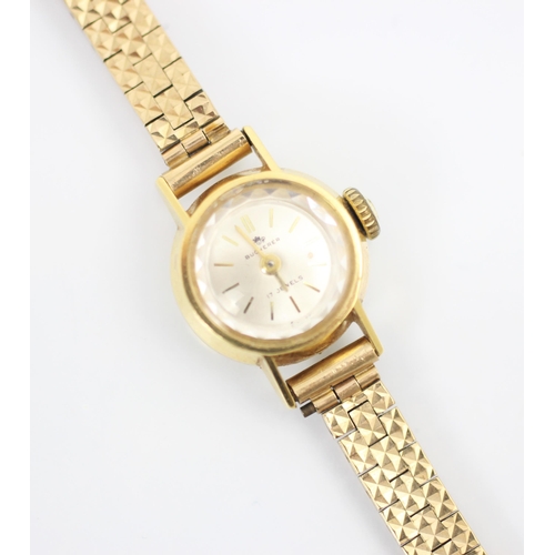 207 - A yellow metal Bucherer ladies wrist watch, the circular white dial with baton markers, set to plain... 