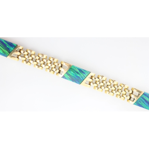 210 - A yellow metal opal doublet set bracelet, the six slices of opal double set within rub over links an... 