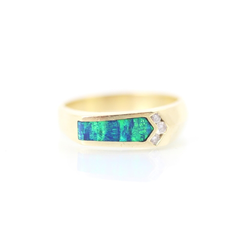 214 - A yellow metal diamond and opal doublet dress ring, the arrow shaped slice of opal doublet with diam... 