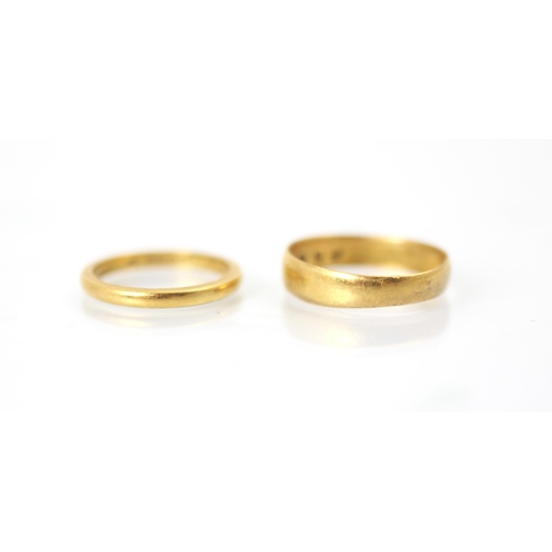 223 - A 22ct yellow gold wedding band, stamped 'HA' Birmingham 1878, ring size M, with a further 22ct yell... 