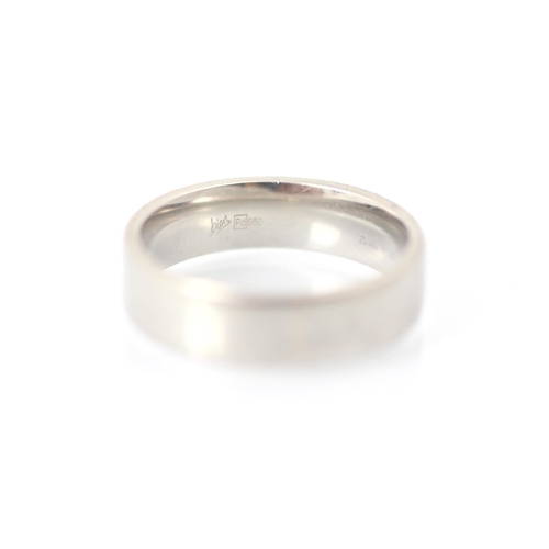 228 - A palladium wedding band, stamped 'Pd 950', ring size R, 7gms