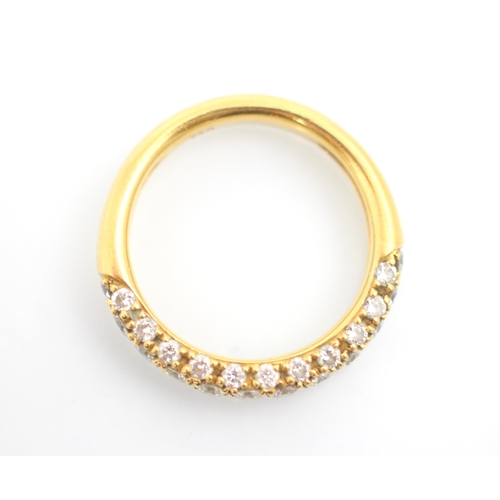 233 - A yellow metal diamond half eternity, the row of twelve round cut diamonds with eleven smaller round... 