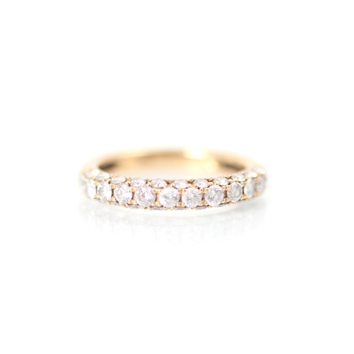 235 - A rose gold diamond half eternity, the row of twelve round cut diamonds with eleven smaller round cu... 