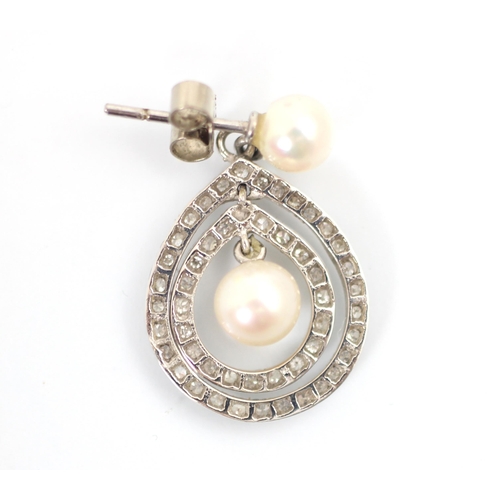 242 - A pair of 20th century style diamond and cultured pearl earrings, the cultured pearl studs suspendin... 