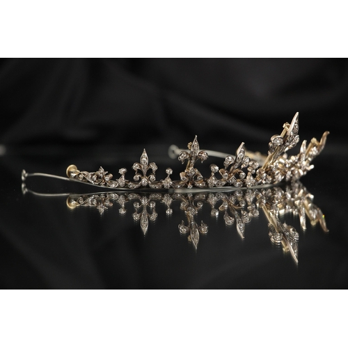 245 - A late 19th/early 20th century diamond set tiara converting to necklace, the central fleur-de-lys mo... 