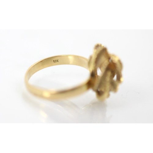 266 - A yellow metal dress ring, the knot designed head with matte and polished frilled detail, set to pla... 