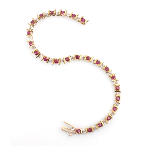 268 - A 9ct untested ruby and diamond bracelet, the round cut red stones with stylised bar interspersed wi... 