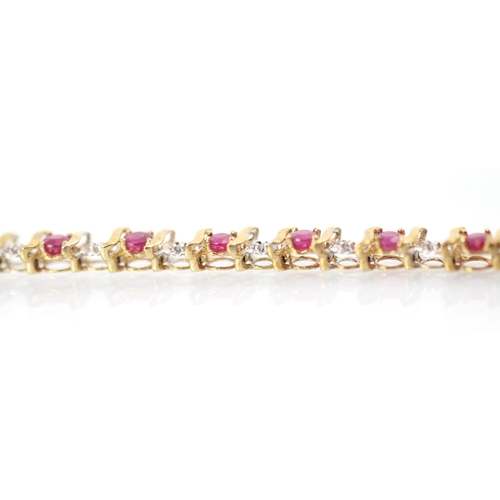 268 - A 9ct untested ruby and diamond bracelet, the round cut red stones with stylised bar interspersed wi... 