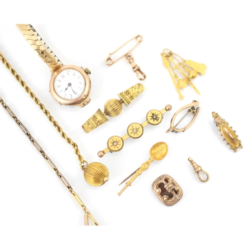 277 - A selection of gold coloured jewellery, including a yellow metal Art Deco style wristwatch, upon ass... 