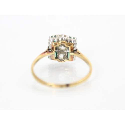 282 - A 20th century Art Deco style diamond and emerald ring, the central old cut diamond with smaller old... 