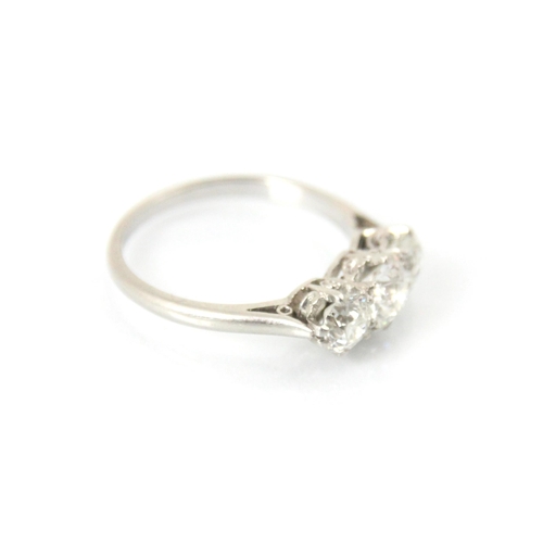 284 - An early 20th century diamond three stone ring, the central old cut diamond with smaller old cut dia... 