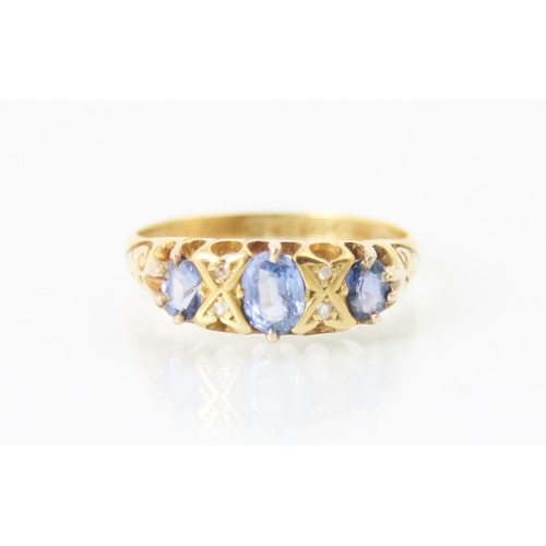 285 - An Edwardian untested sapphire and diamond ring, the central oval cut blue stone with further smalle... 