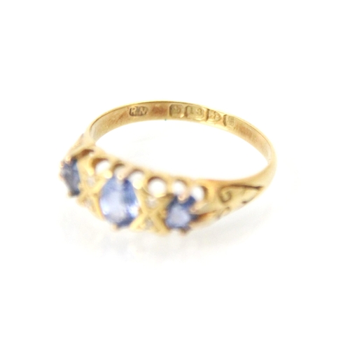 285 - An Edwardian untested sapphire and diamond ring, the central oval cut blue stone with further smalle... 