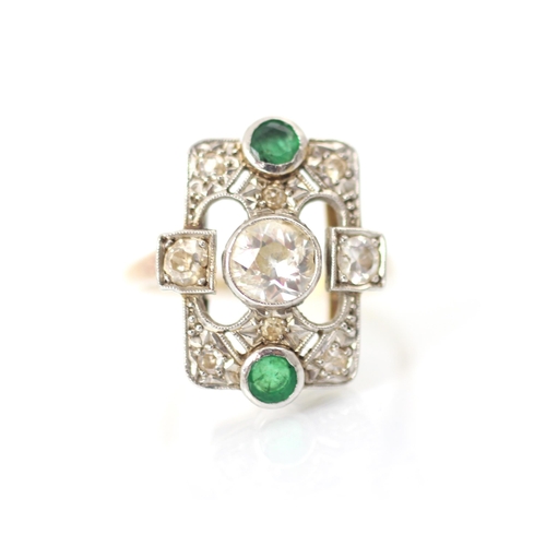 296 - A 20th century diamond and emerald ring, the central old cut diamond in white metal milgrain edge wi... 